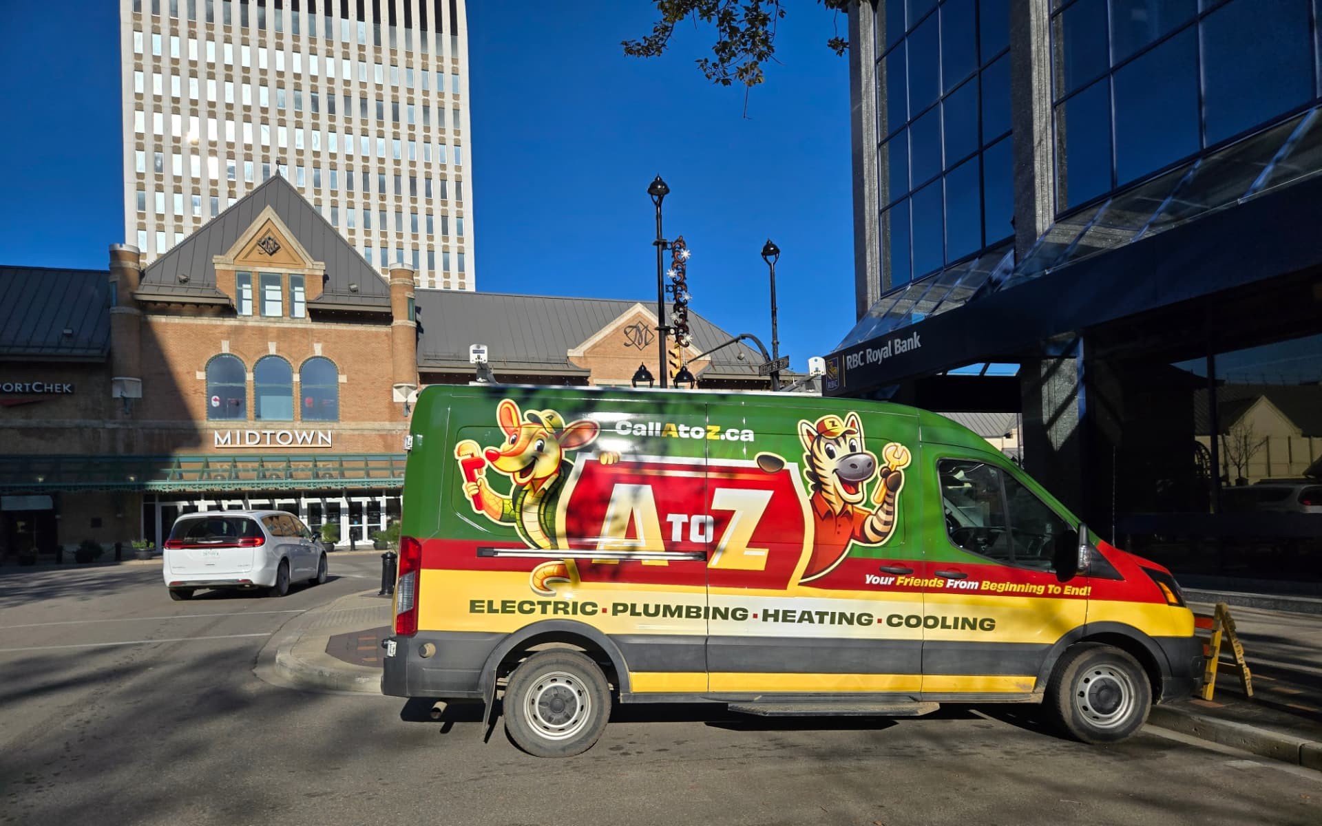 The branded A to Z service van parked downtown in front of Midtown Plaza