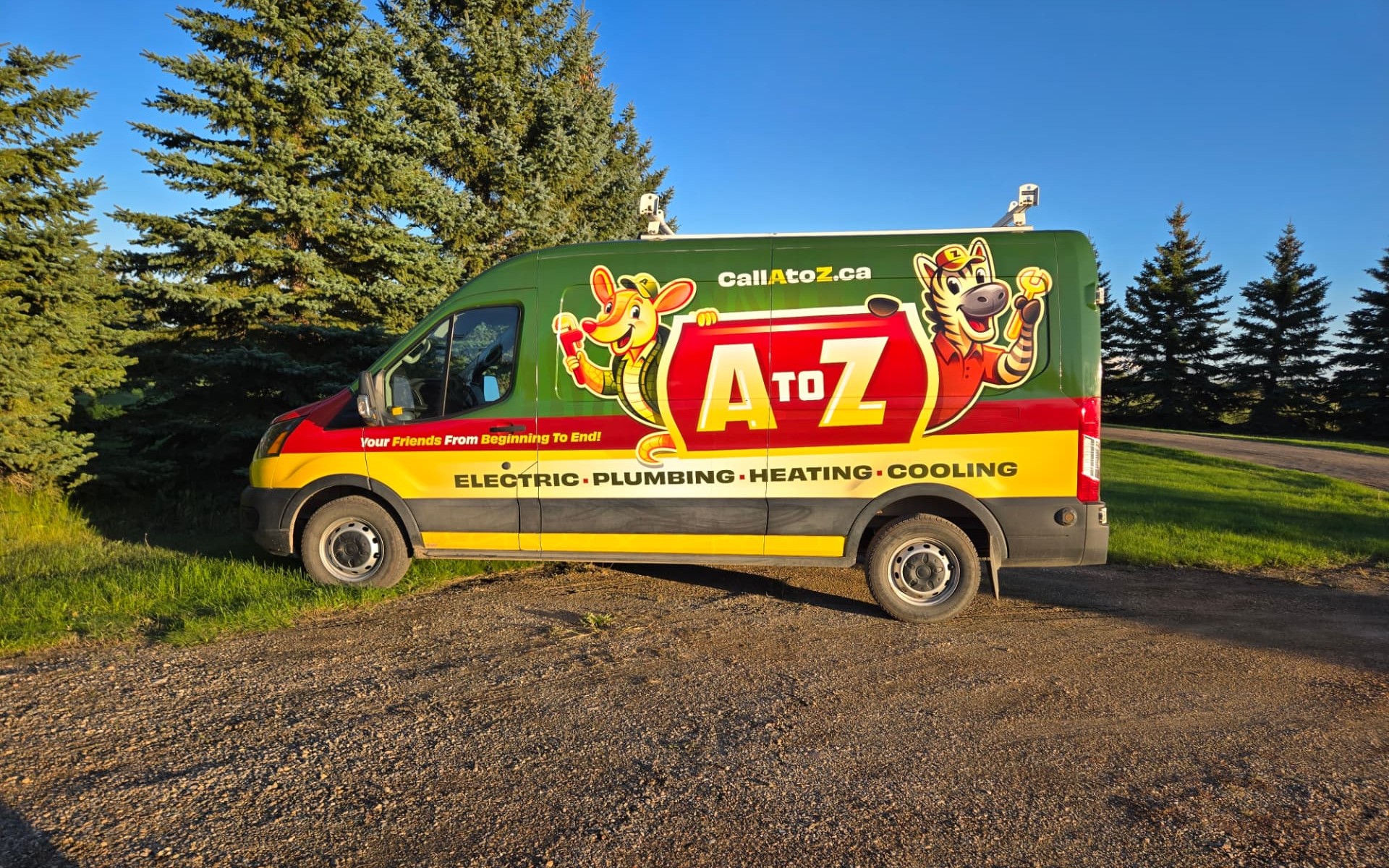 The A to Z service van with its branded wrap parked in front of evergreen trees