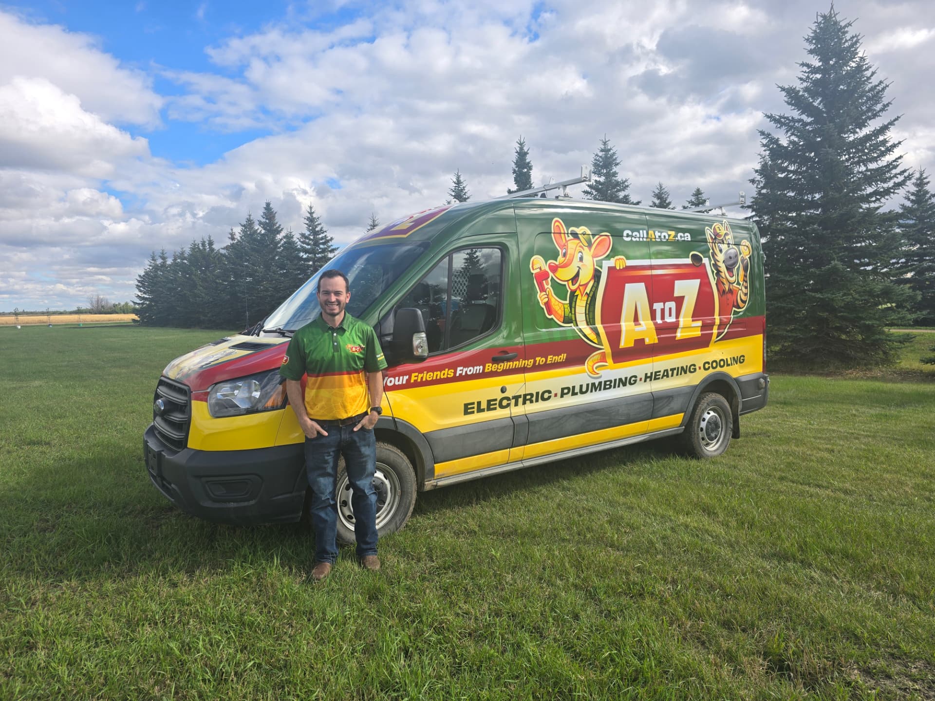 Adam, owner of A to Z, standing beside the branded A to Z service van